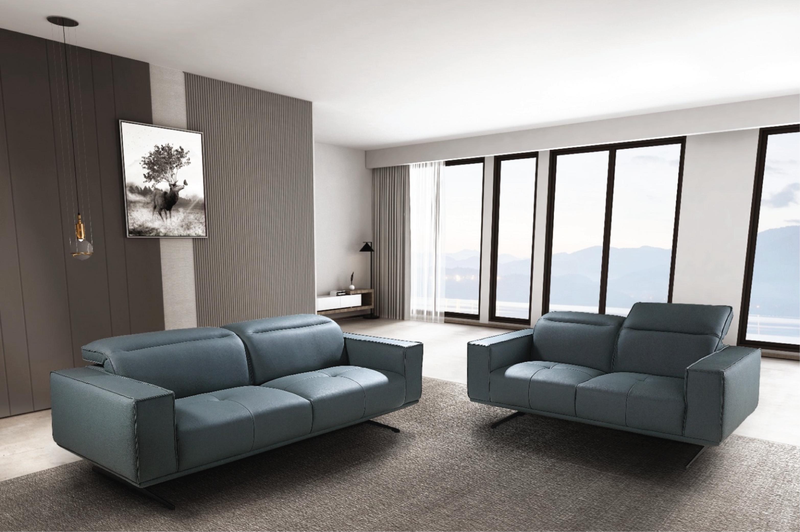 A luxurious, high-end tan leather sofa sits in a minimalist, spacious living room.